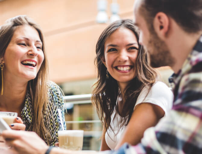 Behavioral health patient enjoys coffee with friends.