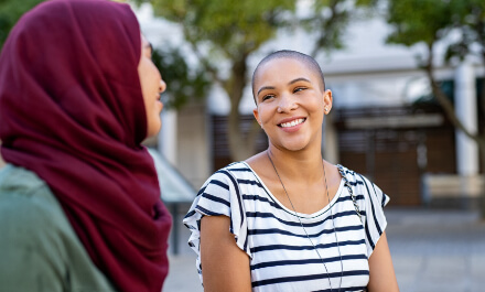 Patient chats with psychiatrist in outdoor setting.