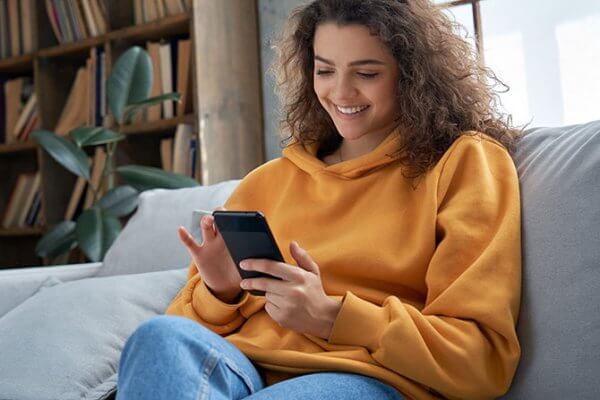 Mental health patient requests appointment online on her mobile device.