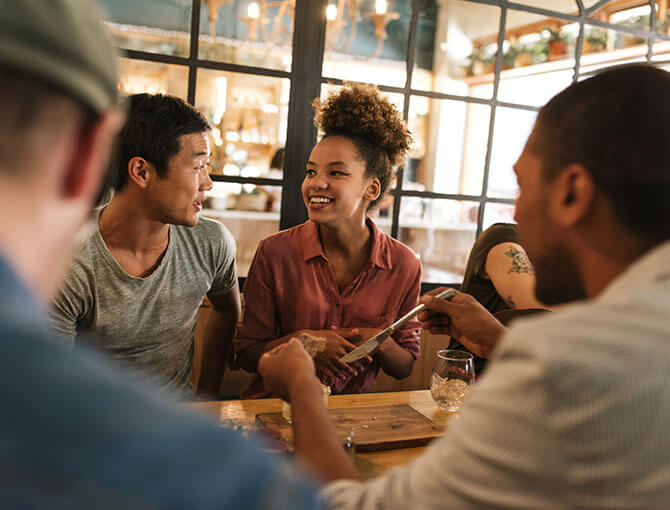 Psychiatric patient enjoys dinner out with friends.